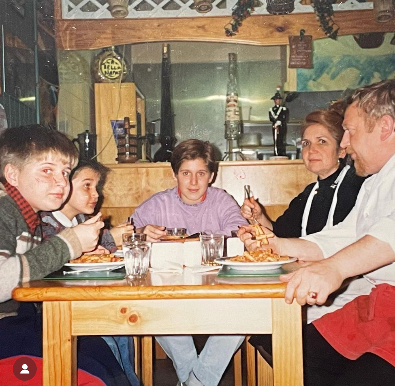 Massimo at the table with his family