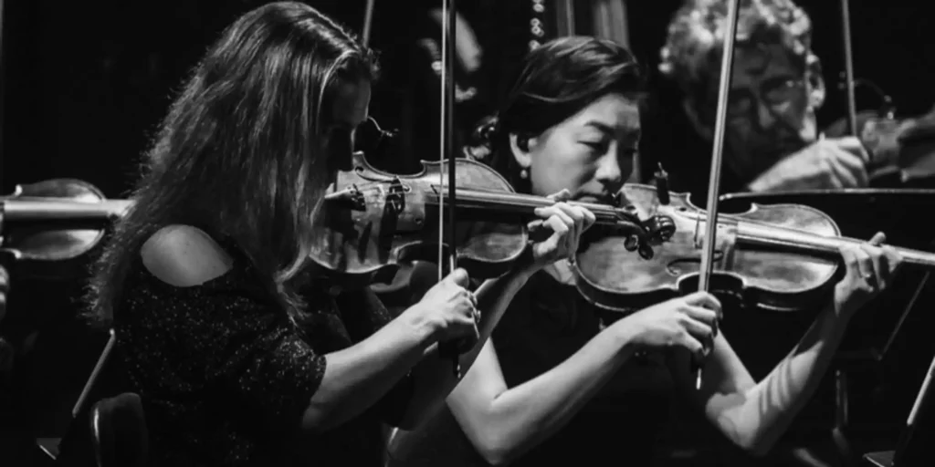 An orchestra playing instruments